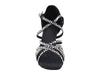 Elegant black heels adorned with sparkling glitter and satin detailing