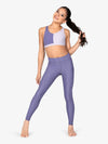 Stylish high waisted purple leggings featuring ribbed design and side pockets
