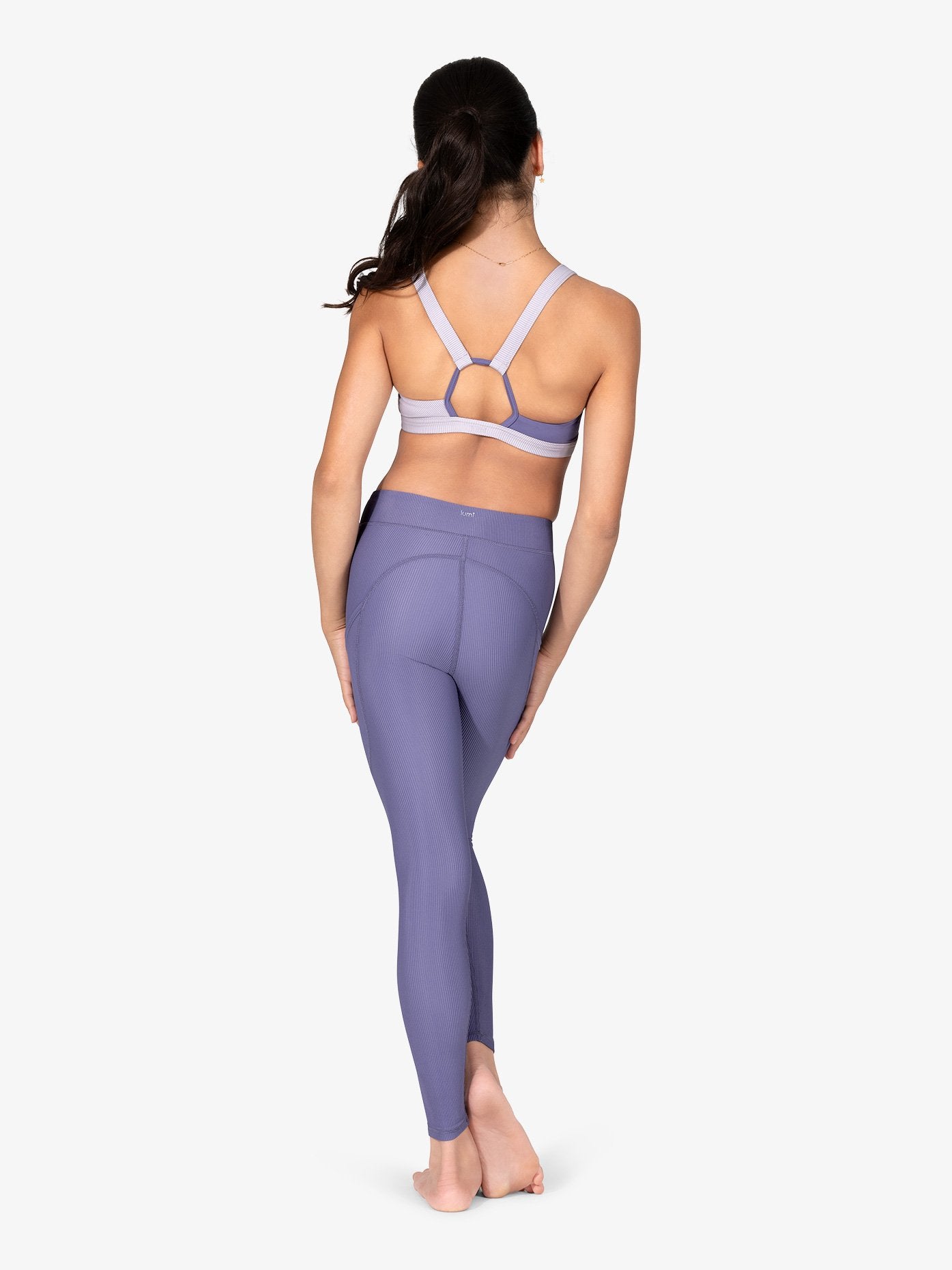 Purple ribbed leggings with convenient side pockets for active wear