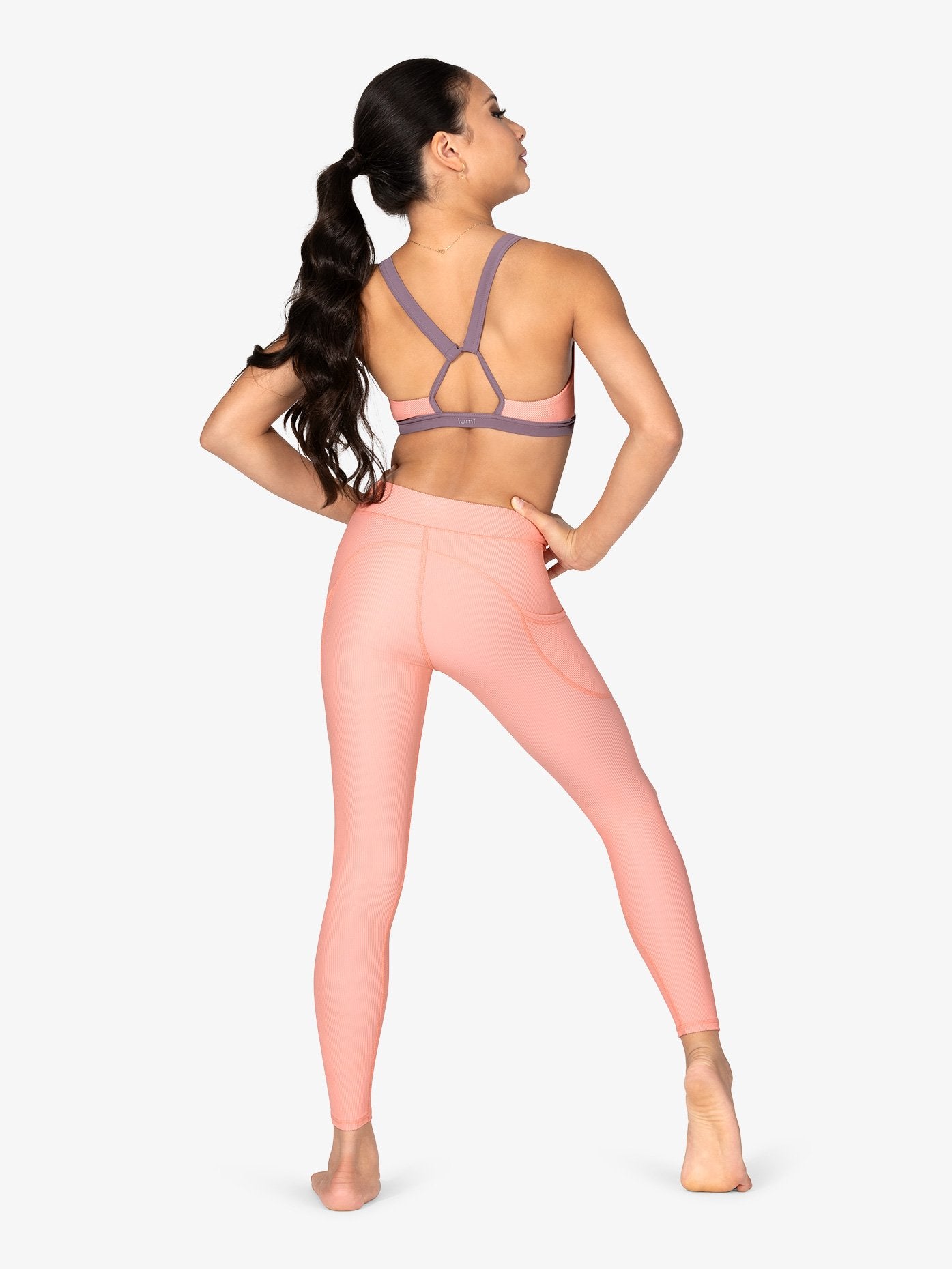 peach ribbed leggings highlighting side pockets