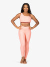 Women's peach-colored ribbed leggings with high waist and side pockets