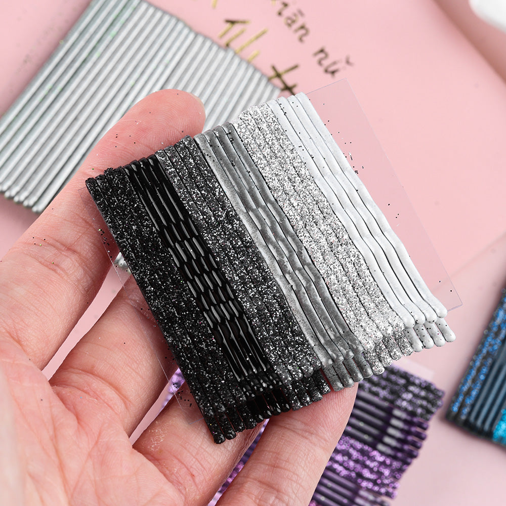 Set of 24 black and white bobby pins for hair styling